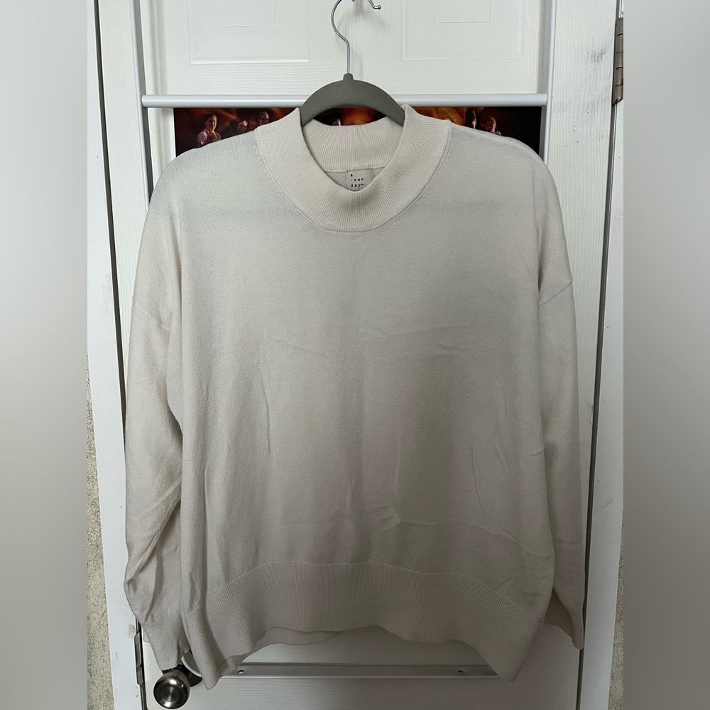 A New Day sweater